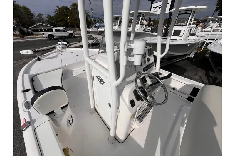 Slide: The Image of 2023 Tidewater 2210 Carolina Bay boat interior with steering console and seating. - 14