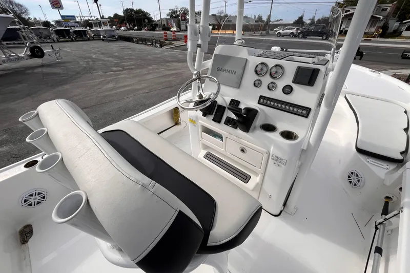 Slide: The Image of 2023 Tidewater 2210 Carolina Bay boat console with Garmin navigation and seating. - 7