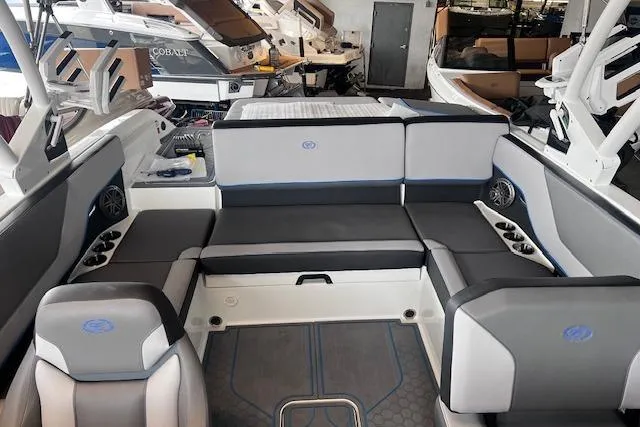 Slide: The Image of 2025 Cobalt CS23 Surf boat interior with sleek seating and modern design. - 14