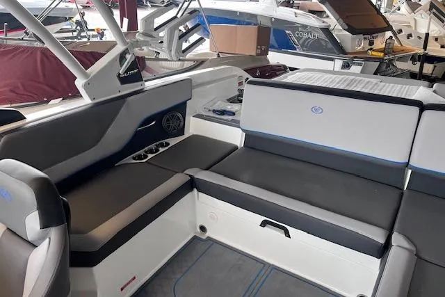 Slide: The Image of 2025 Cobalt CS23 Surf boat interior with sleek seating and modern design. - 16