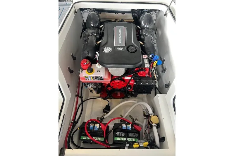 Slide: The Image of 2025 Cobalt CS23 Surf engine compartment with Volvo Penta engine and Interstate batteries. - 17