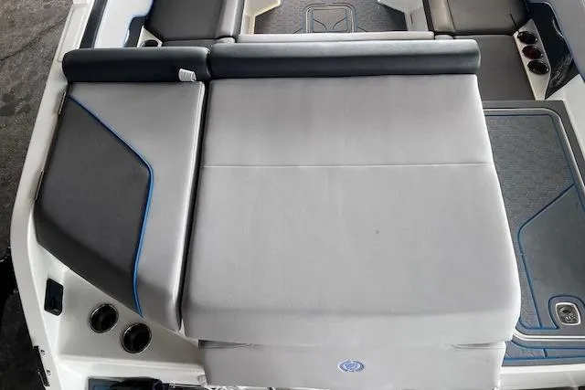Slide: The Image of 2025 Cobalt CS23 Surf boat interior with cushioned seating and modern design. - 21