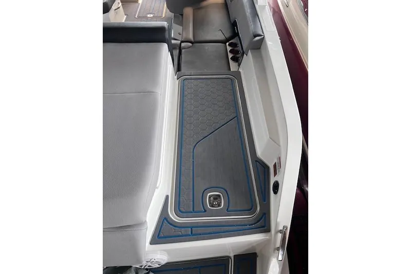 Slide: The Image of Interior view of 2025 Cobalt CS23 Surf boat with sleek seating and flooring design. - 22