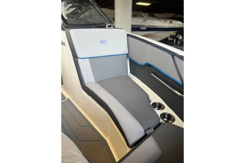 Slide: The Image of 2025 Cobalt CS23 Surf boat interior with sleek seating and cup holders. - 4