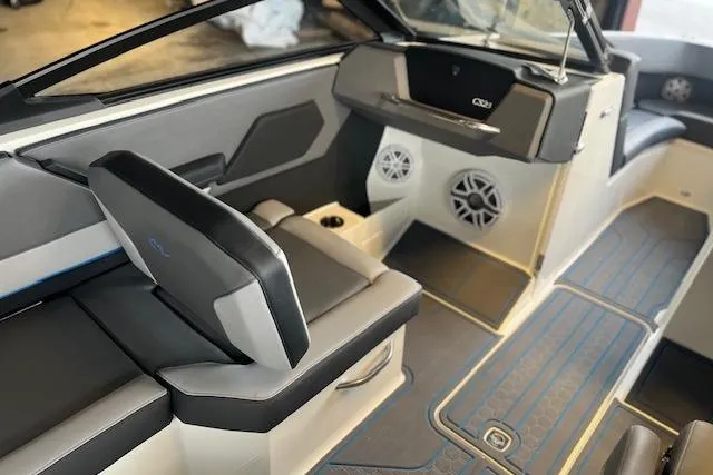 Slide: The Image of 2025 Cobalt CS23 Surf boat interior with sleek seating and modern design. - 9
