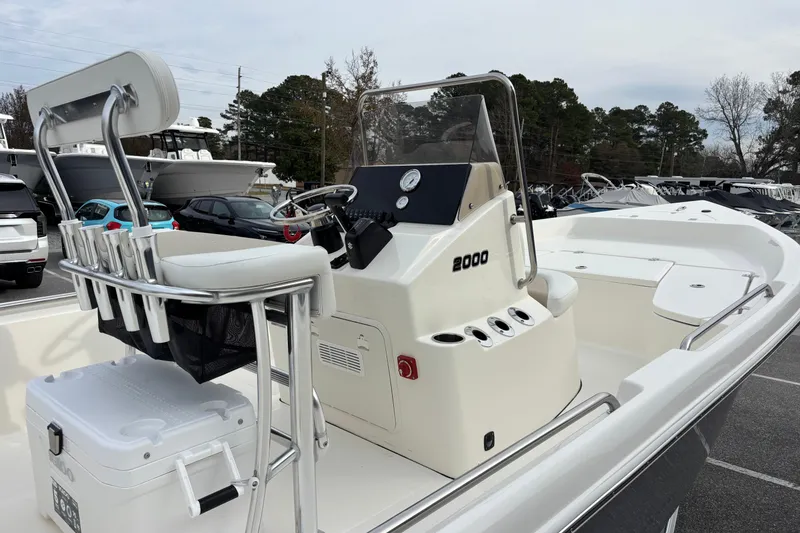Slide: The Image of 2026 Bulls Bay 2000 boat with center console and seating, displayed outdoors. - 11