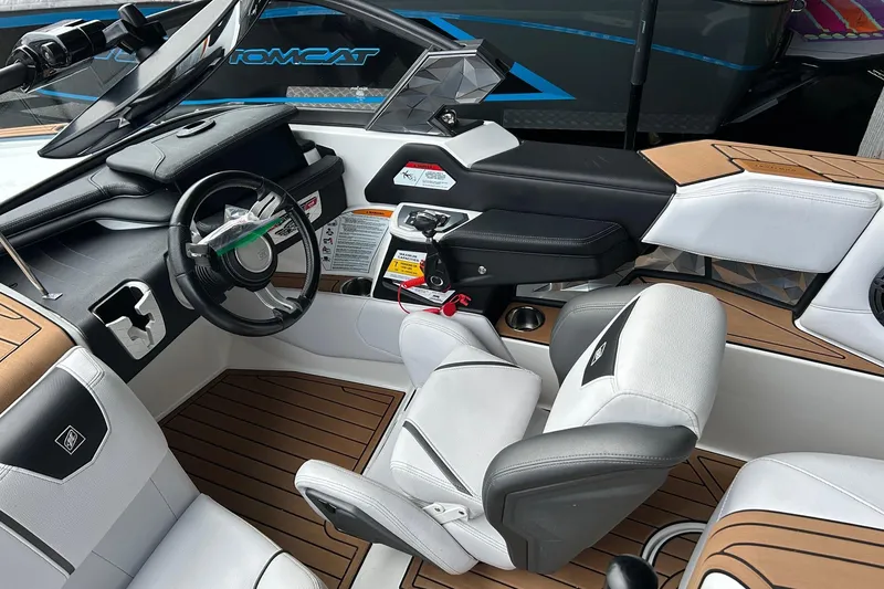 Slide: The Image of 2019 Nautique Ski Nautique boat interior with modern dashboard and seating. - 14