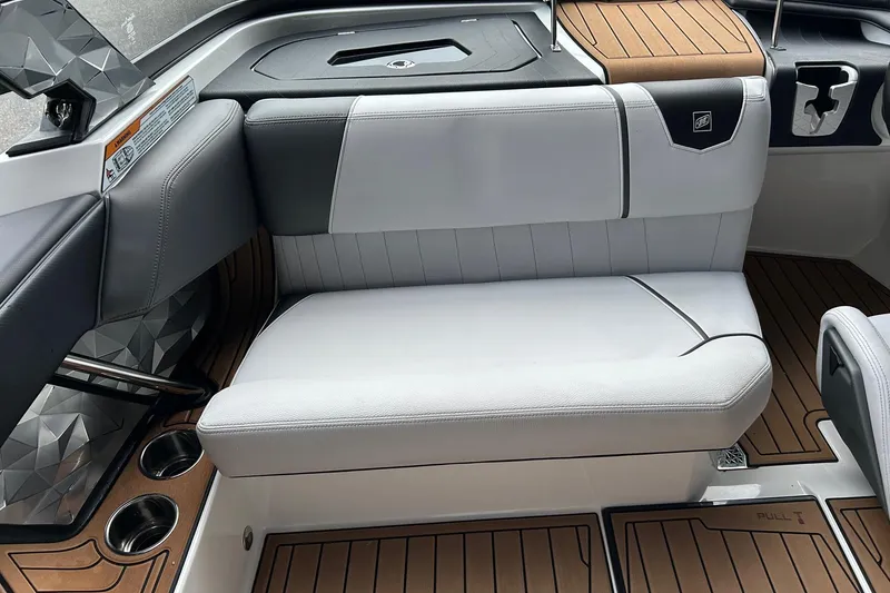 Slide: The Image of 2019 Nautique Ski Nautique interior seating with modern design and wood accents. - 18