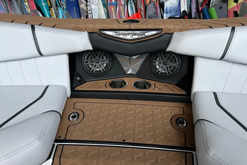 Slide: The Image of 2019 Nautique Ski Nautique interior with JL Audio speakers and stylish seating. - 23