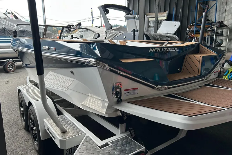 Slide: The Image of 2019 Nautique Ski Nautique boat on trailer in a storage facility. - 7