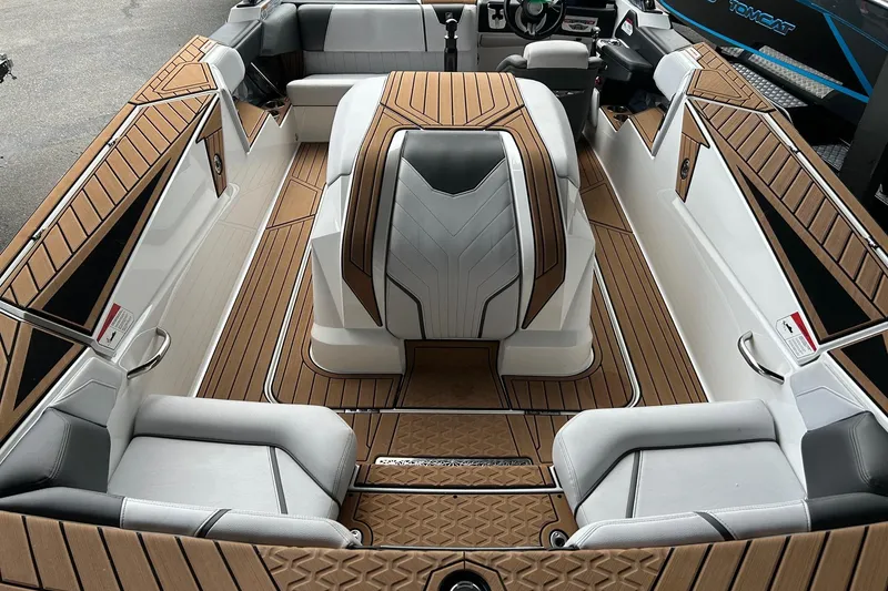 Slide: The Image of 2019 Nautique Ski Nautique interior with sleek seating and wood accents. - 8