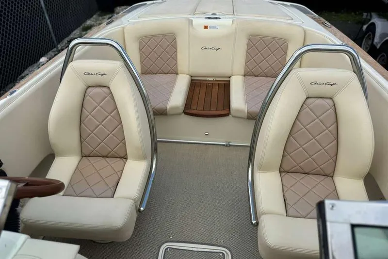 Slide: The Image of 2018 Chris-Craft Launch 23 interior with beige diamond-stitched seats and elegant design. - 17