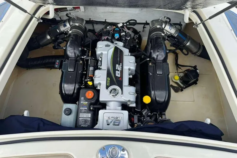 Slide: The Image of Engine compartment of a 2018 Chris-Craft Launch 23 boat, featuring a powerful V8 engine. - 27