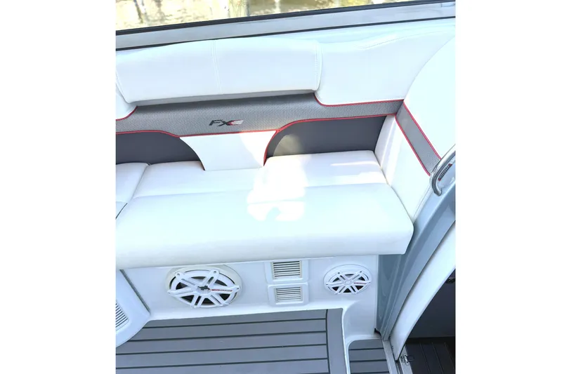 Slide: The Image of 2015 Formula 400 Super Sport boat interior with white seating and speaker system. - 11
