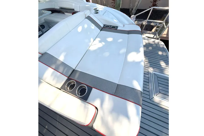 Slide: The Image of 2015 Formula 400 Super Sport boat with sleek white seating and modern design. - 13