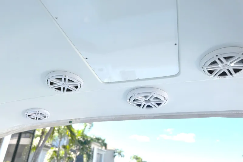 Slide: The Image of Ceiling speakers on a 2015 Formula 400 Super Sport boat under a clear blue sky. - 16