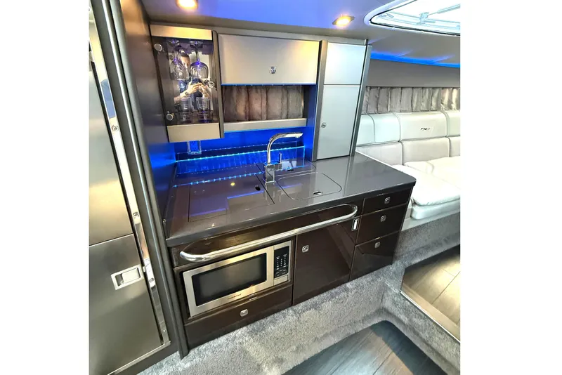 Slide: The Image of Luxurious interior of 2015 Formula 400 Super Sport yacht with modern kitchenette and seating area. - 21