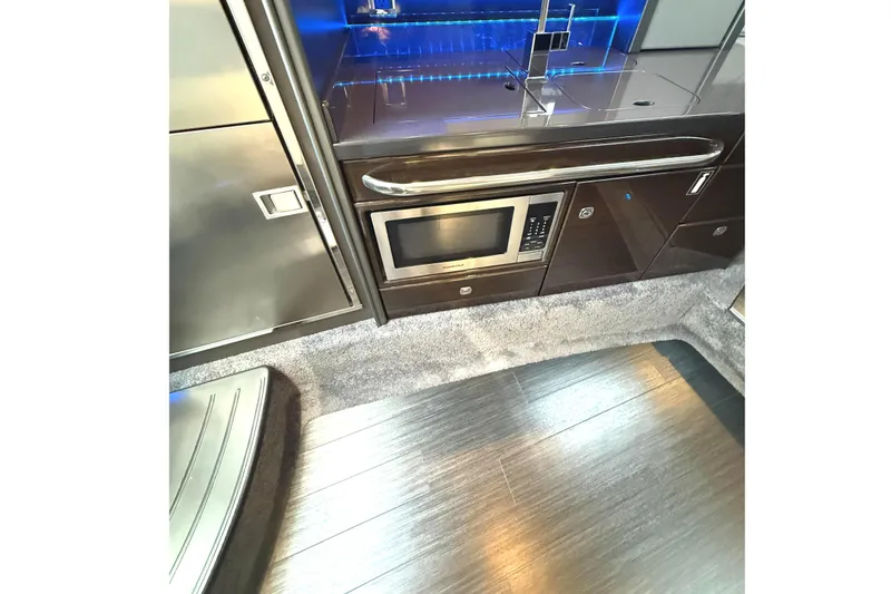 Slide: The Image of 2015 Formula 400 Super Sport yacht interior kitchen with modern appliances and sleek design. - 22
