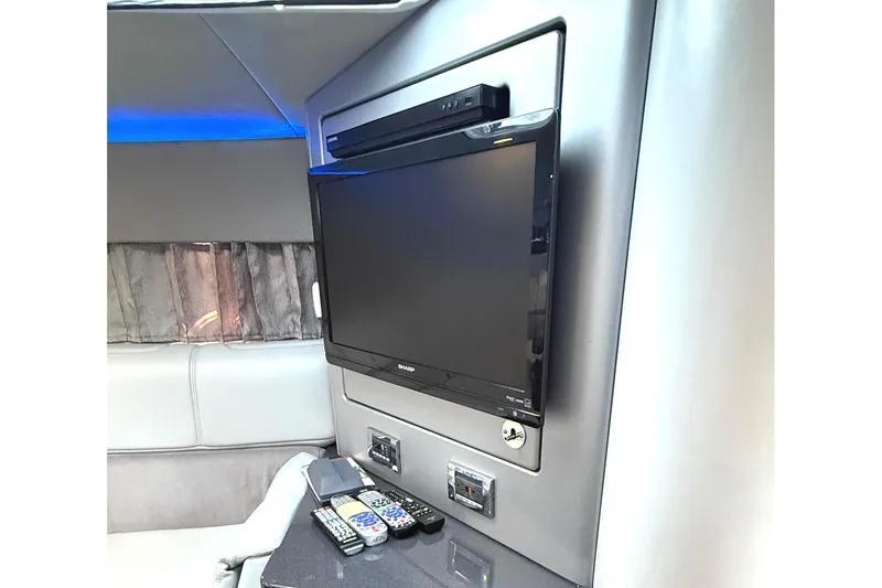 Slide: The Image of Interior of 2015 Formula 400 Super Sport with TV and remote controls on a counter. - 27