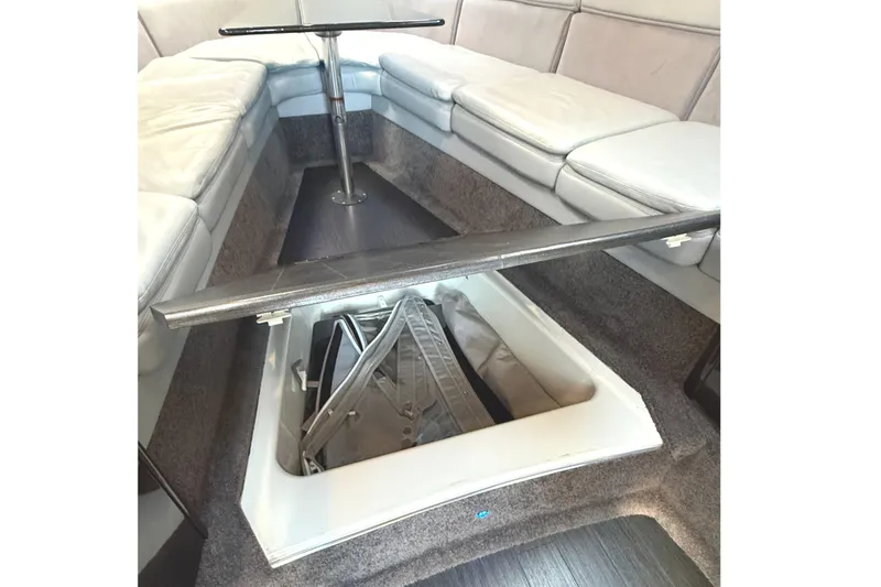 Slide: The Image of Interior view of 2015 Formula 400 Super Sport boat with open storage compartment. - 28