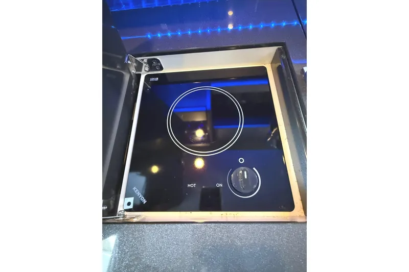 Slide: The Image of Built-in Kenyon cooktop on 2015 Formula 400 Super Sport yacht, featuring sleek black design. - 29