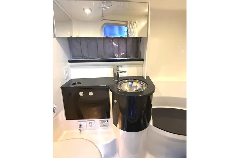 Slide: The Image of 2015 Formula 400 Super Sport yacht bathroom with modern sink and mirror. - 32
