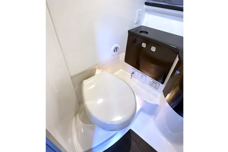 Slide: The Image of 2015 Formula 400 Super Sport yacht bathroom with modern toilet and sleek design. - 33