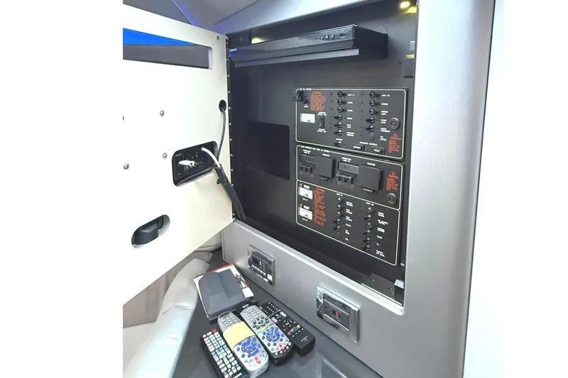 Slide: The Image of Control panel and remotes inside 2015 Formula 400 Super Sport boat cabin. - 40