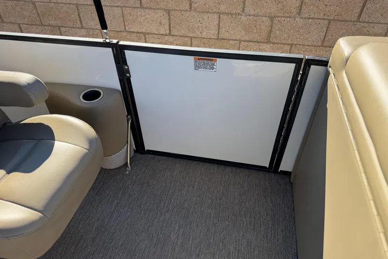 Slide: The Image of 2021 Starcraft SLS 3 boat interior with beige seating and cup holder. - 16