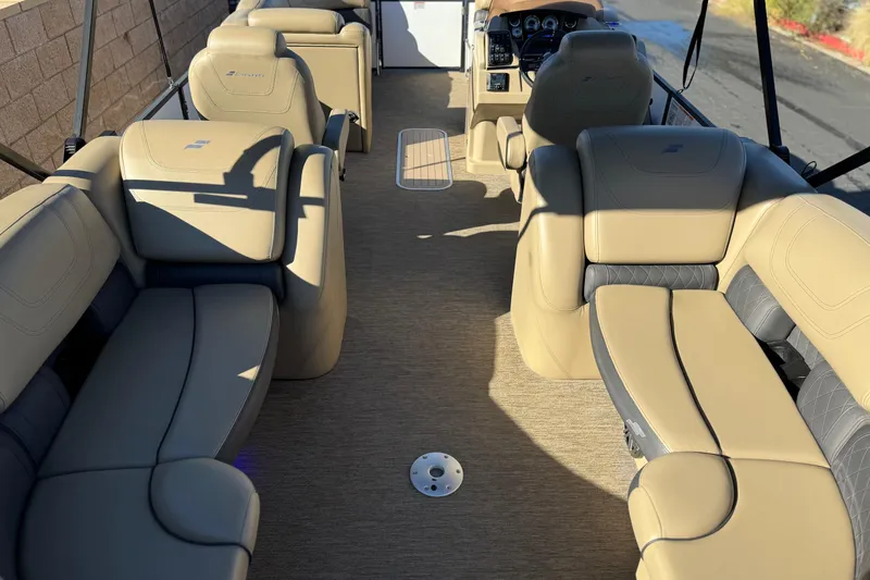 Slide: The Image of 2021 Starcraft SLS 3 boat interior with beige seating and steering console. - 23