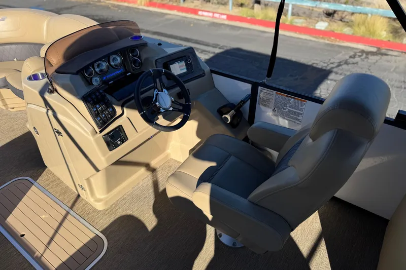 Slide: The Image of 2021 Starcraft SLS 3 boat cockpit with steering wheel and control panel. - 25