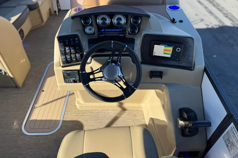 Slide: The Image of 2021 Starcraft SLS 3 boat dashboard with steering wheel and control panel. - 26