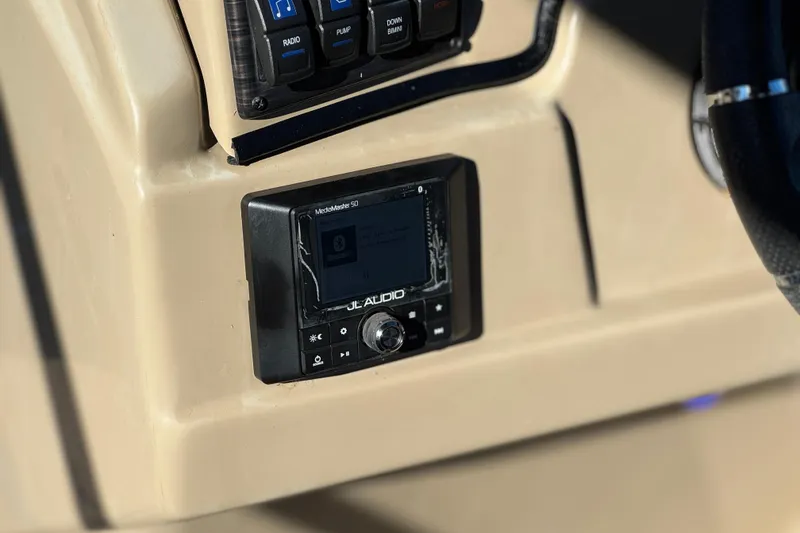 Slide: The Image of Control panel of a 2021 Starcraft SLS 3 boat with audio system. - 27
