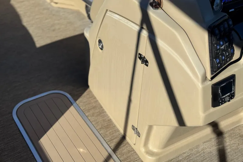 Slide: The Image of 2021 Starcraft SLS 3 boat console with control panel and storage compartment. - 30