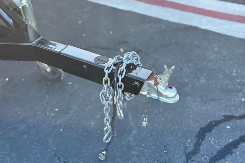 Slide: The Image of Trailer hitch with safety chains on a 2021 Starcraft SLS 3. - 32