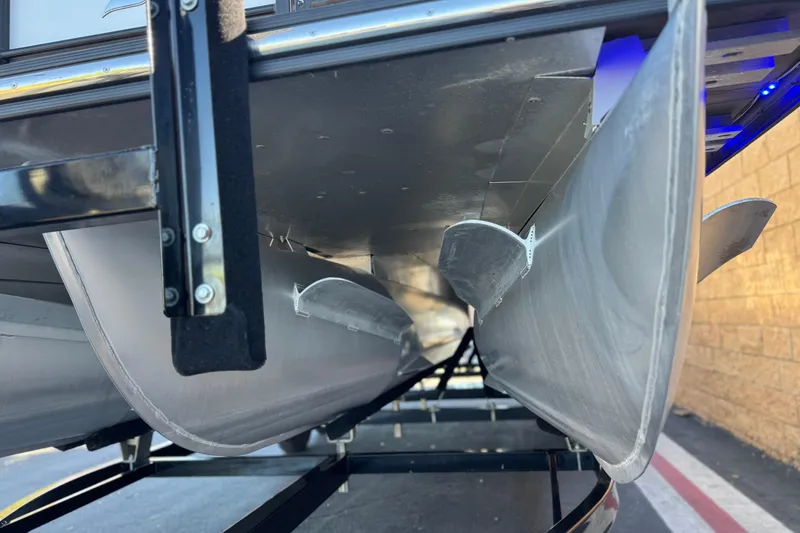 Slide: The Image of Underneath view of a 2021 Starcraft SLS 3 pontoon boat on a trailer. - 4