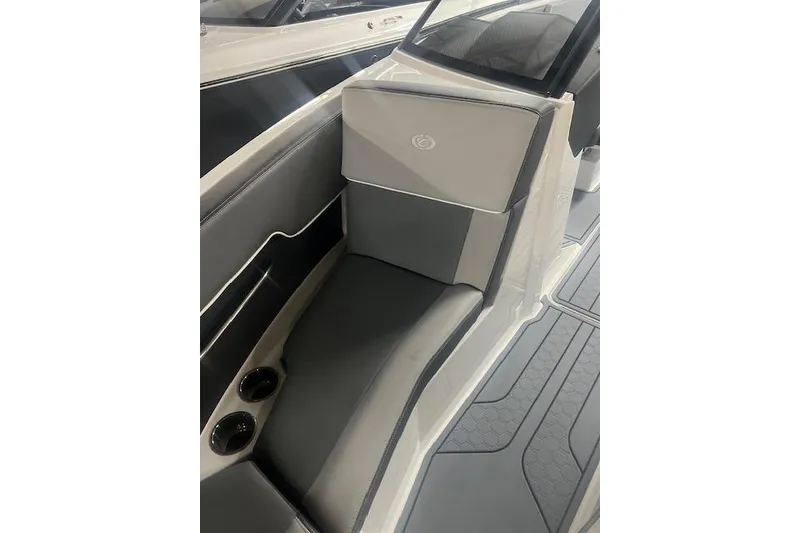 Slide: The Image of 2025 Cobalt CS23 Surf boat interior with sleek seating and cup holders. - 10