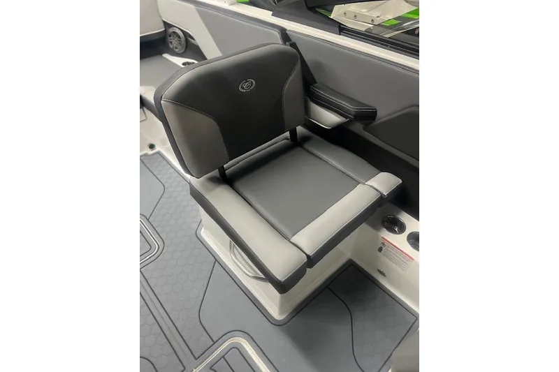 Slide: The Image of 2025 Cobalt CS23 Surf boat seat, black and gray upholstery, modern design. - 12
