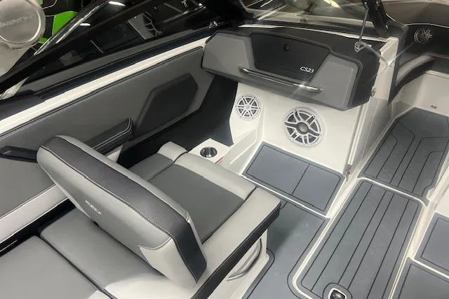 Slide: The Image of 2025 Cobalt CS23 Surf boat interior with sleek seating and modern design. - 13