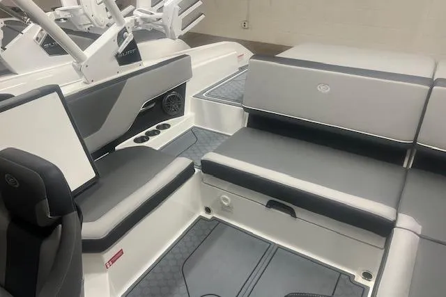 Slide: The Image of 2025 Cobalt CS23 Surf boat interior with sleek gray seating and modern design. - 20