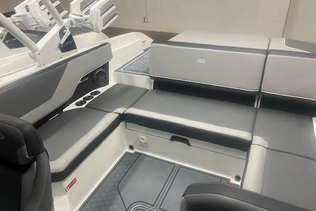 Slide: The Image of 2025 Cobalt CS23 Surf boat interior with sleek gray seating and modern design. - 21
