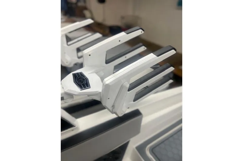 Slide: The Image of 2025 Cobalt CS23 Surf boat detail, featuring sleek white and black design elements. - 24