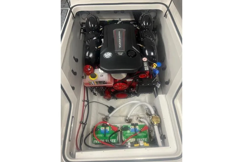 Slide: The Image of 2025 Cobalt CS23 Surf engine compartment with Volvo Penta engine and Interstate batteries. - 26