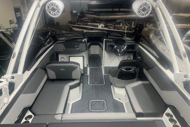 Slide: The Image of 2025 Cobalt CS23 Surf boat interior with modern seating and audio system. - 28