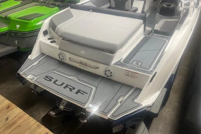 Slide: The Image of 2025 Cobalt CS23 Surf boat with sleek design and spacious seating. - 29