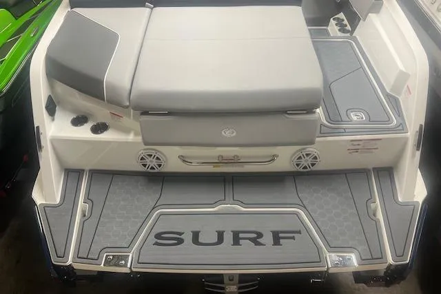 Slide: The Image of 2025 Cobalt CS23 Surf boat with sleek design and spacious seating area. - 31