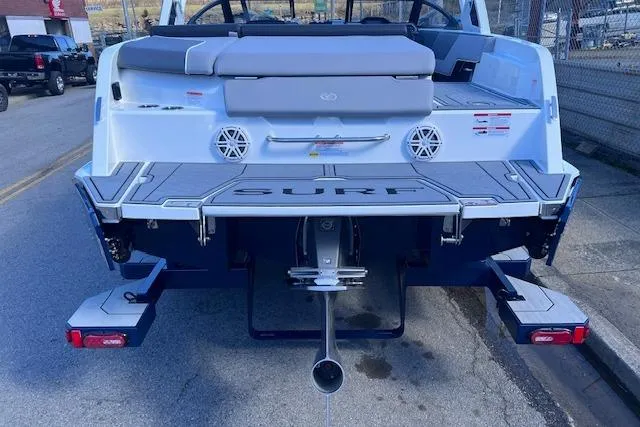 Slide: The Image of 2025 Cobalt CS23 Surf boat rear view with swim platform and speakers. - 33