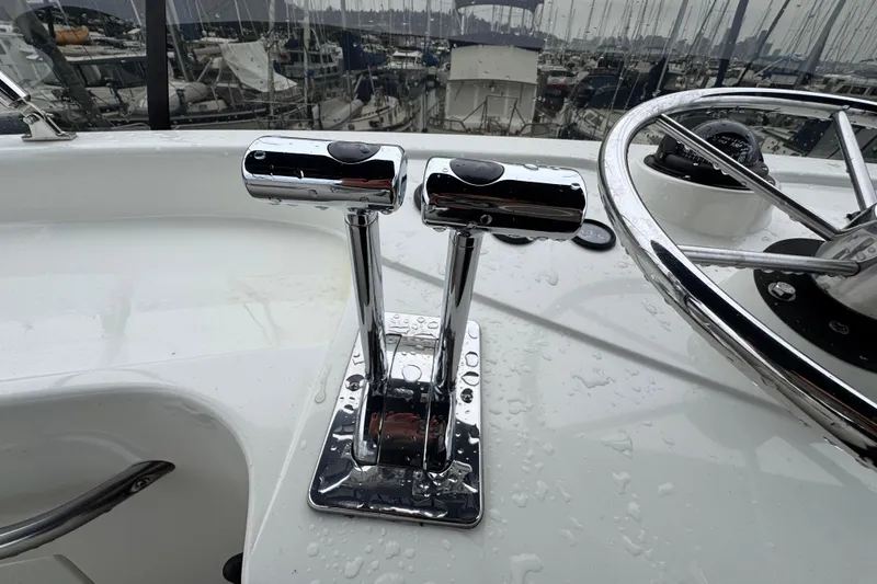 Slide: The Image of Chrome throttle controls and steering wheel on a 1974 Tollycraft 40 Tri-Cabin MY yacht. - 30