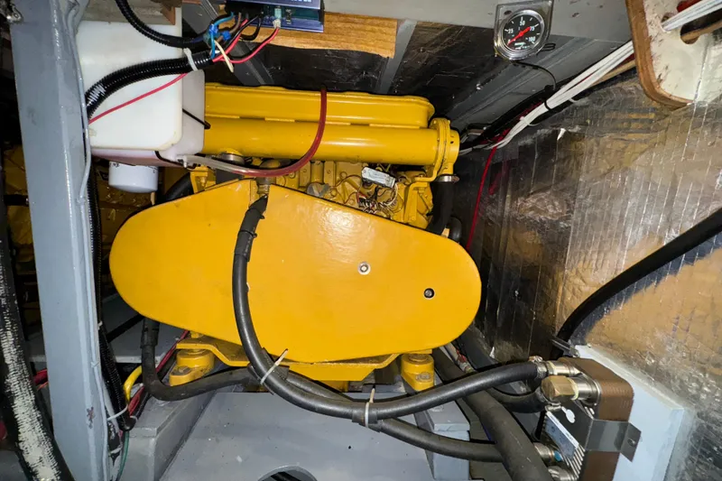 Slide: The Image of Engine room of 1974 Tollycraft 40 Tri-Cabin MY with yellow machinery and wiring. - 41