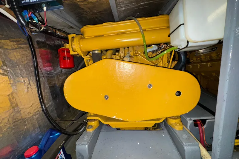 Slide: The Image of Engine room of 1974 Tollycraft 40 Tri-Cabin MY with yellow machinery. - 43